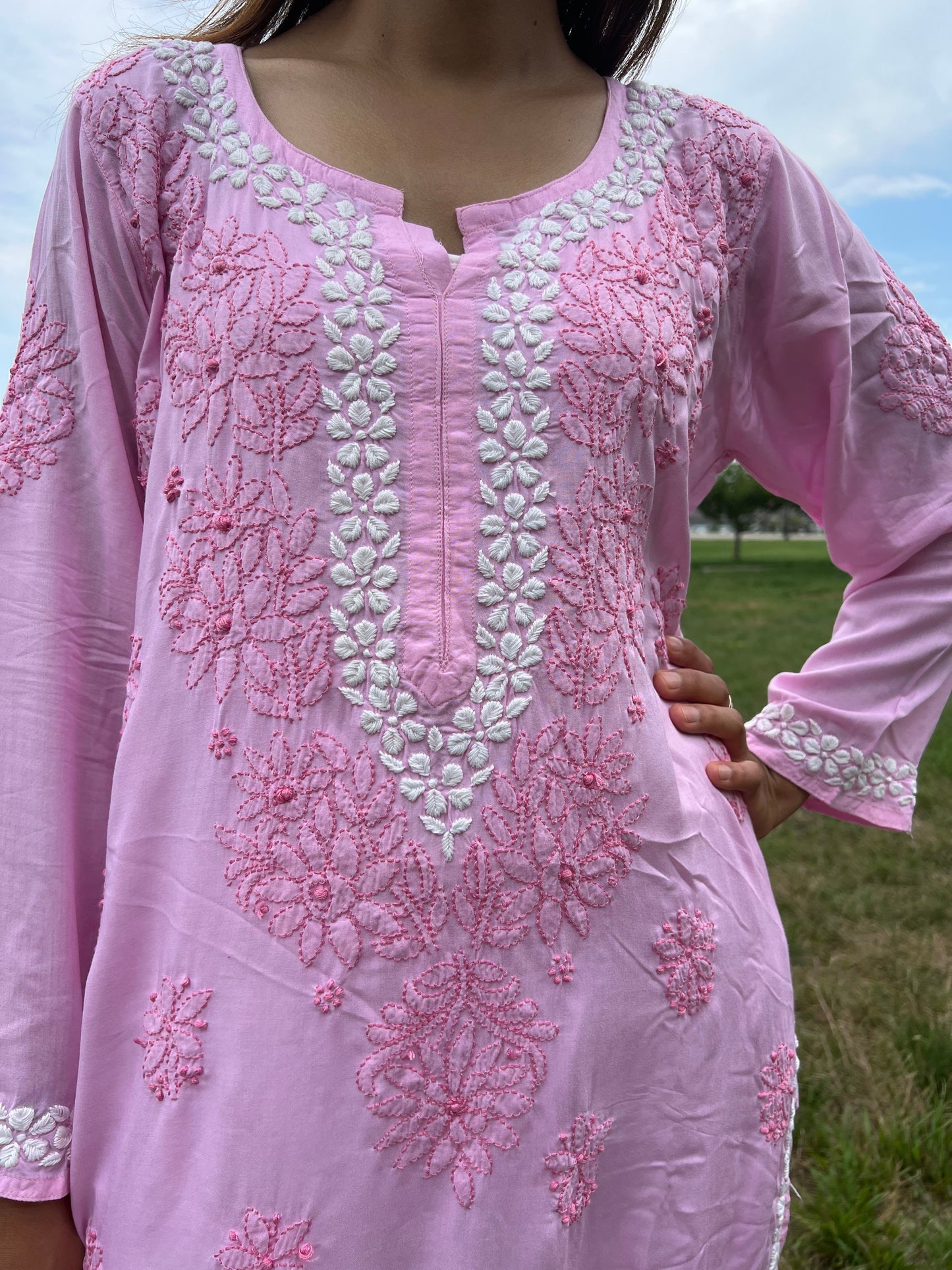 Chikankari floral border in white threads in neckline and floral bail and booti in dark pink threads