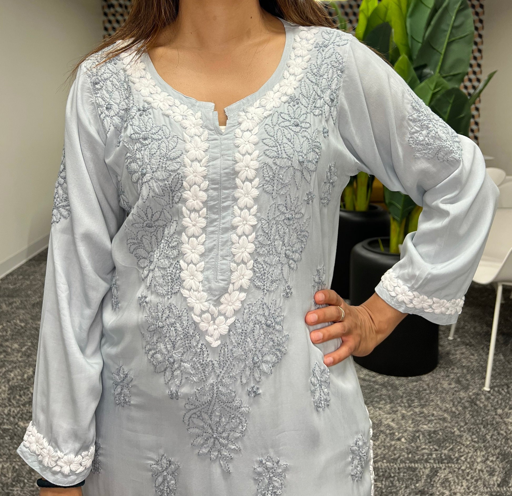 Chikankari floral border in white threads in neckline and floral booti in grey threads all over