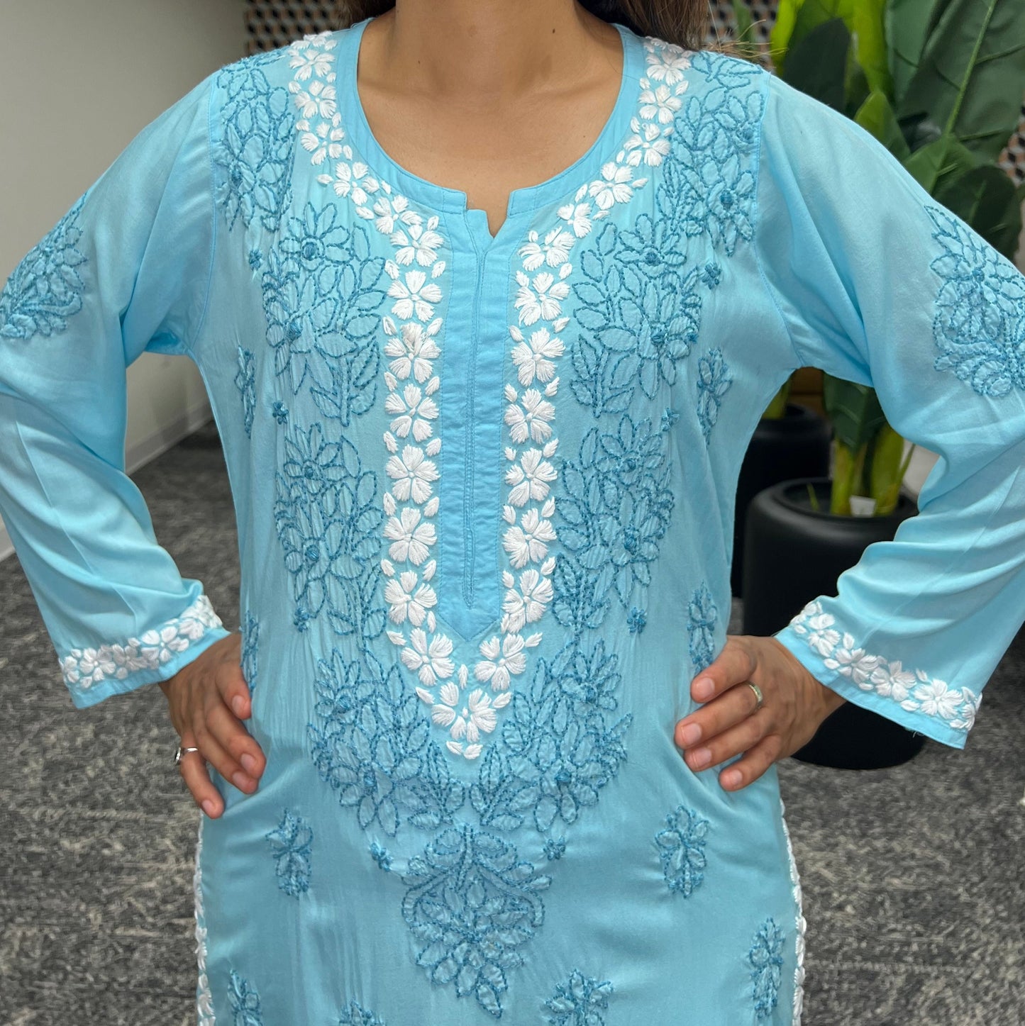 Chikankari floral border in white threads in neckline and floral bail and booti in dark blue threads