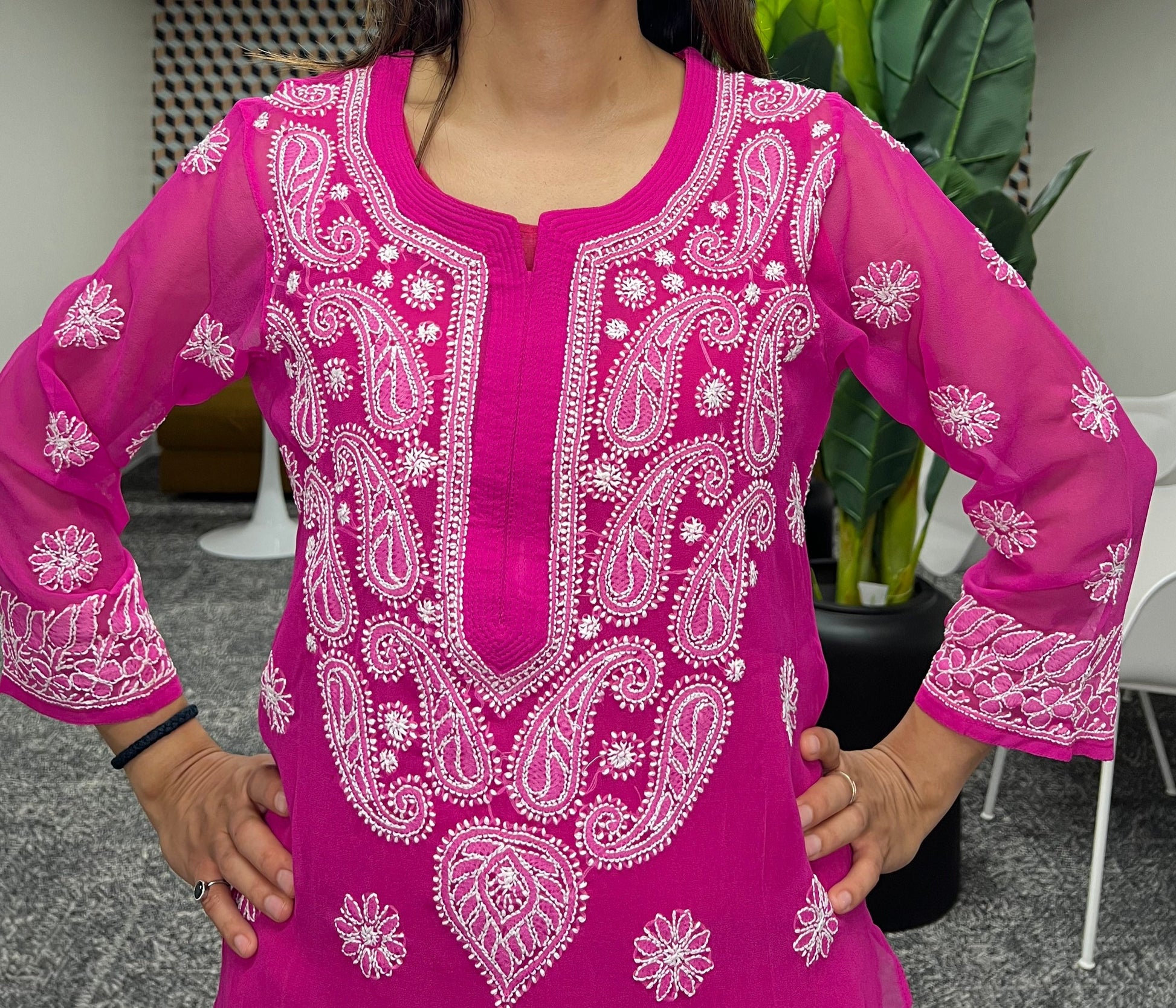 Detailed chikankari all over the neckline and chest area with white threads