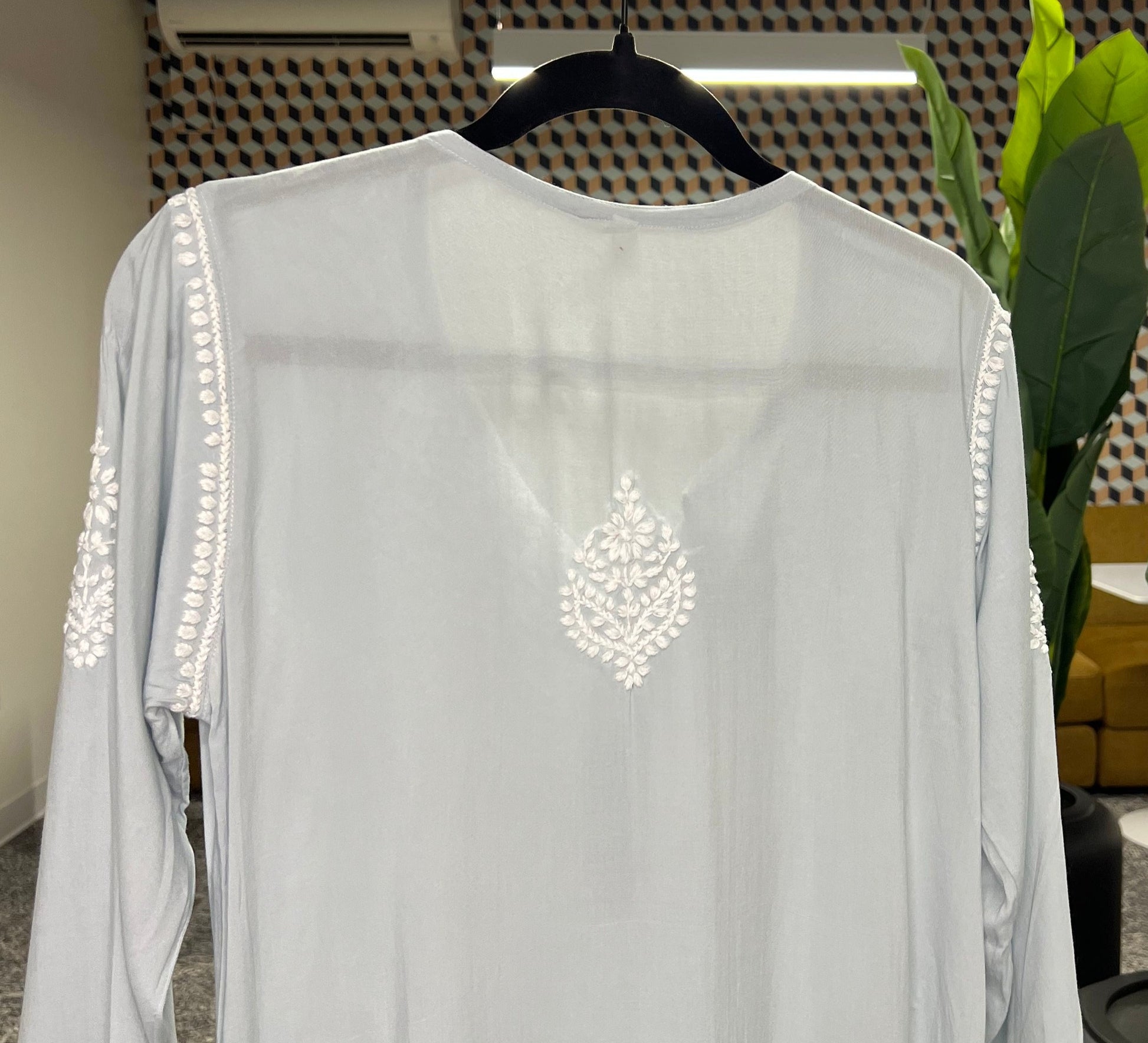 Chikankari booti in white threads on kurta back